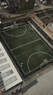 An aerial view of a basketball court in a city