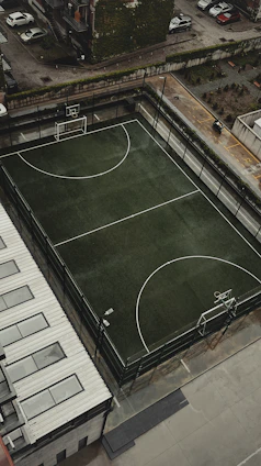 An aerial view of a basketball court in a city