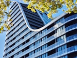 a very tall building with a curved roof