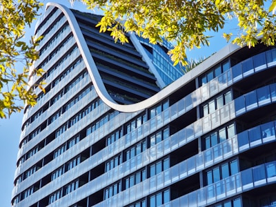 a very tall building with a curved roof