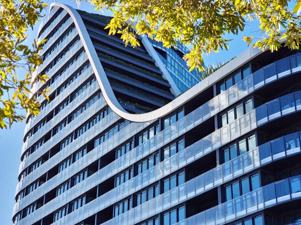 a very tall building with a curved roof