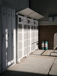 a row of white lockers sitting next to each other