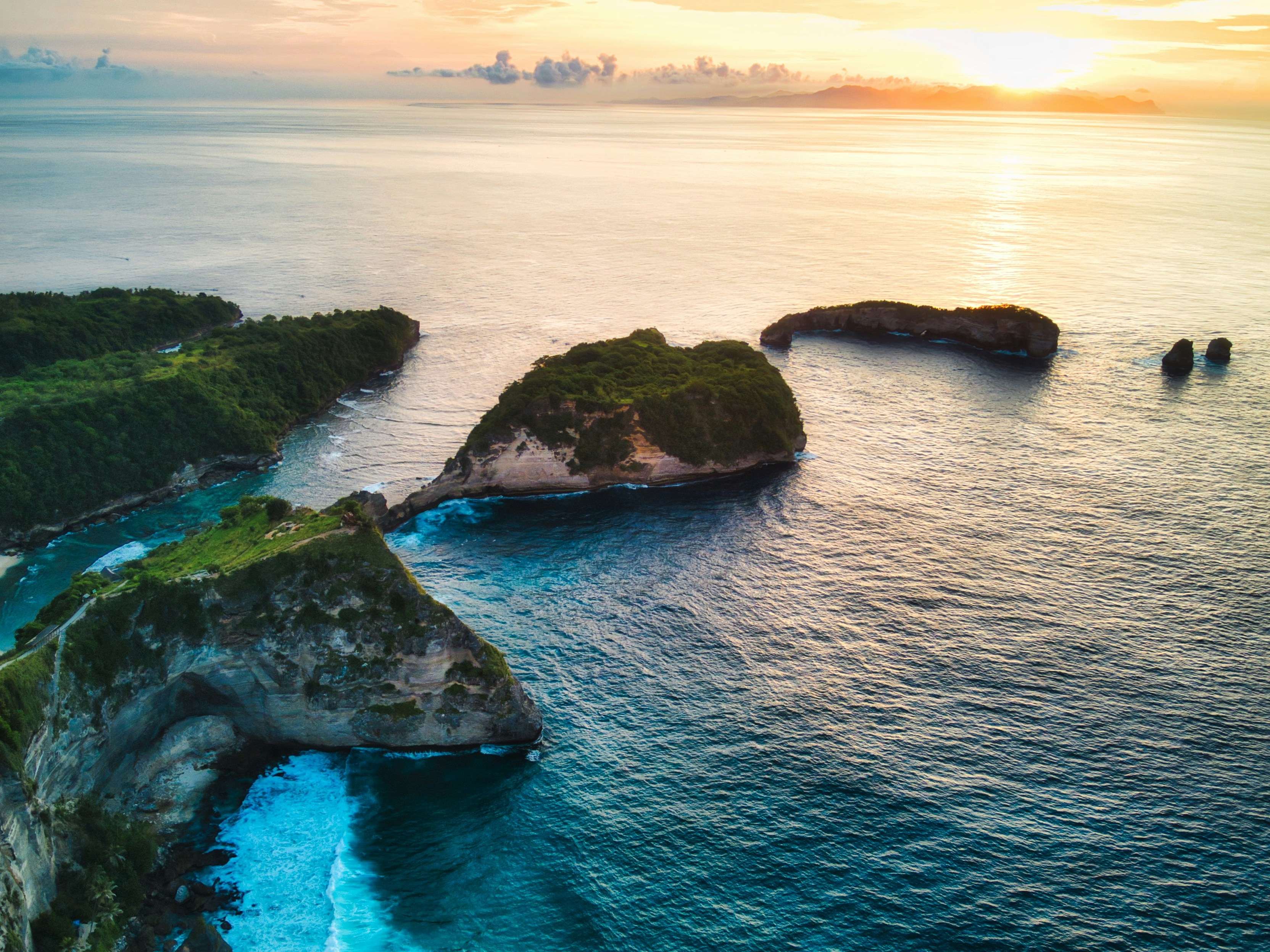 an aerial view of an island in the middle of the ocean