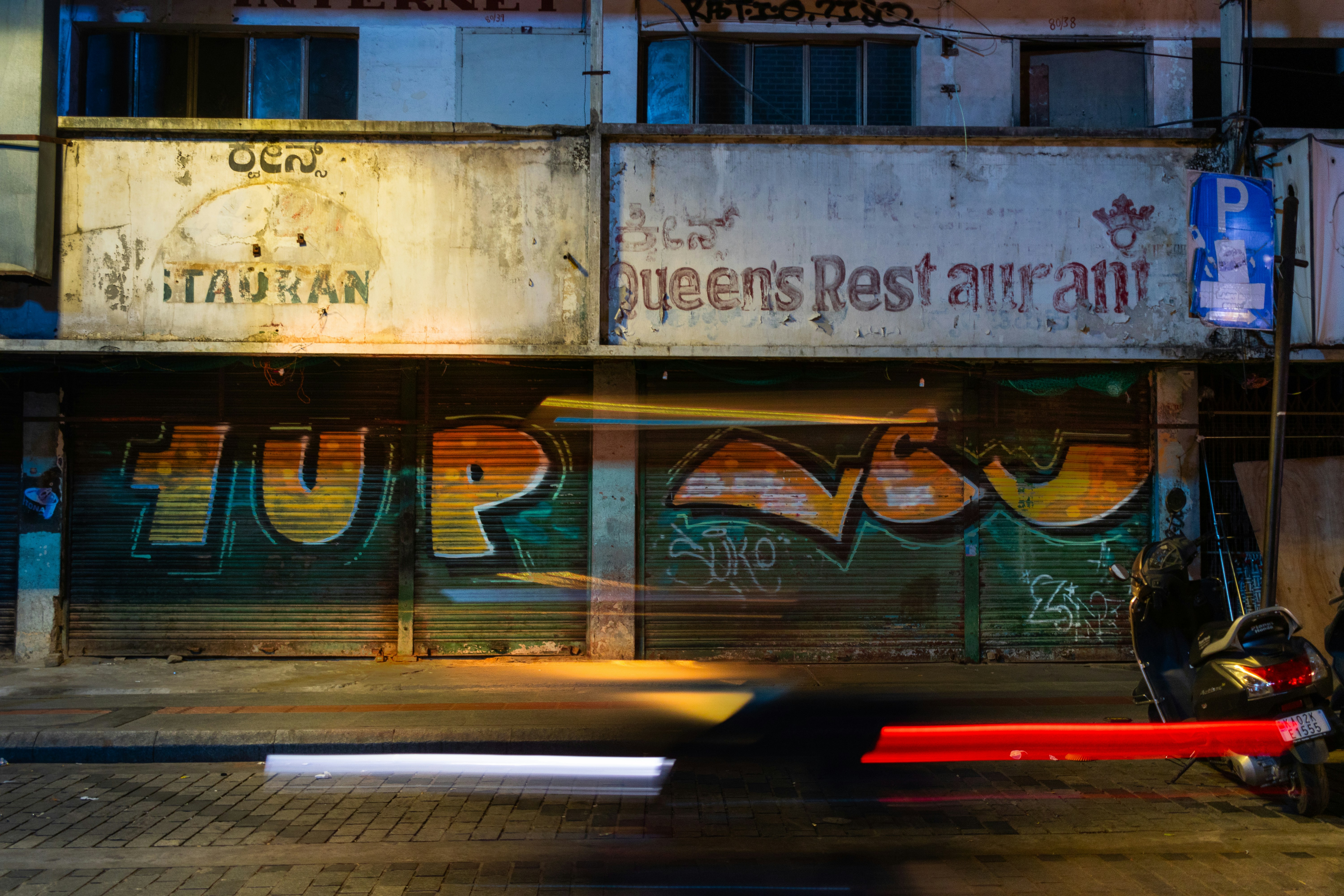 a blurry photo of a building with graffiti on it