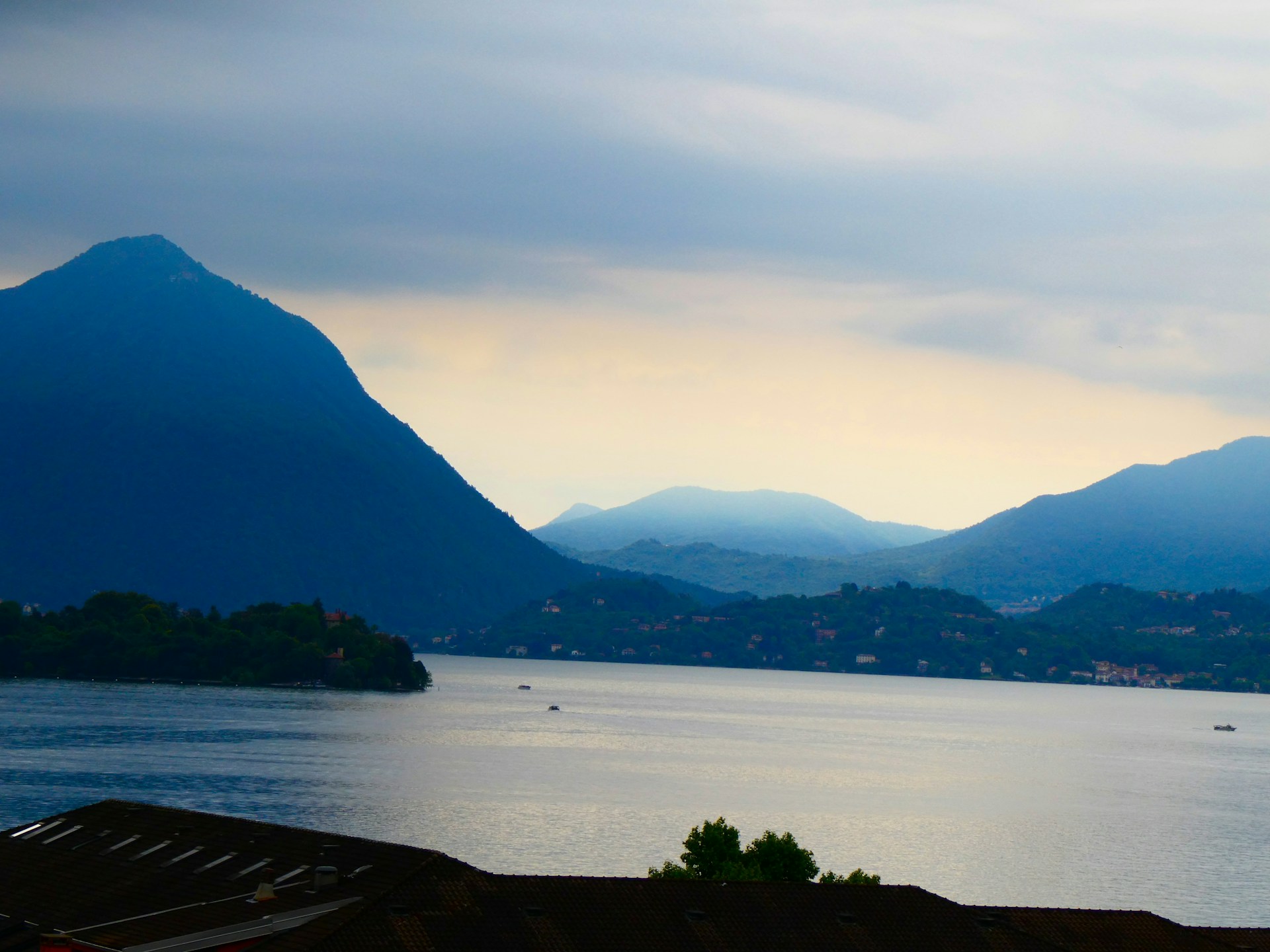 a body of water with mountains in the background