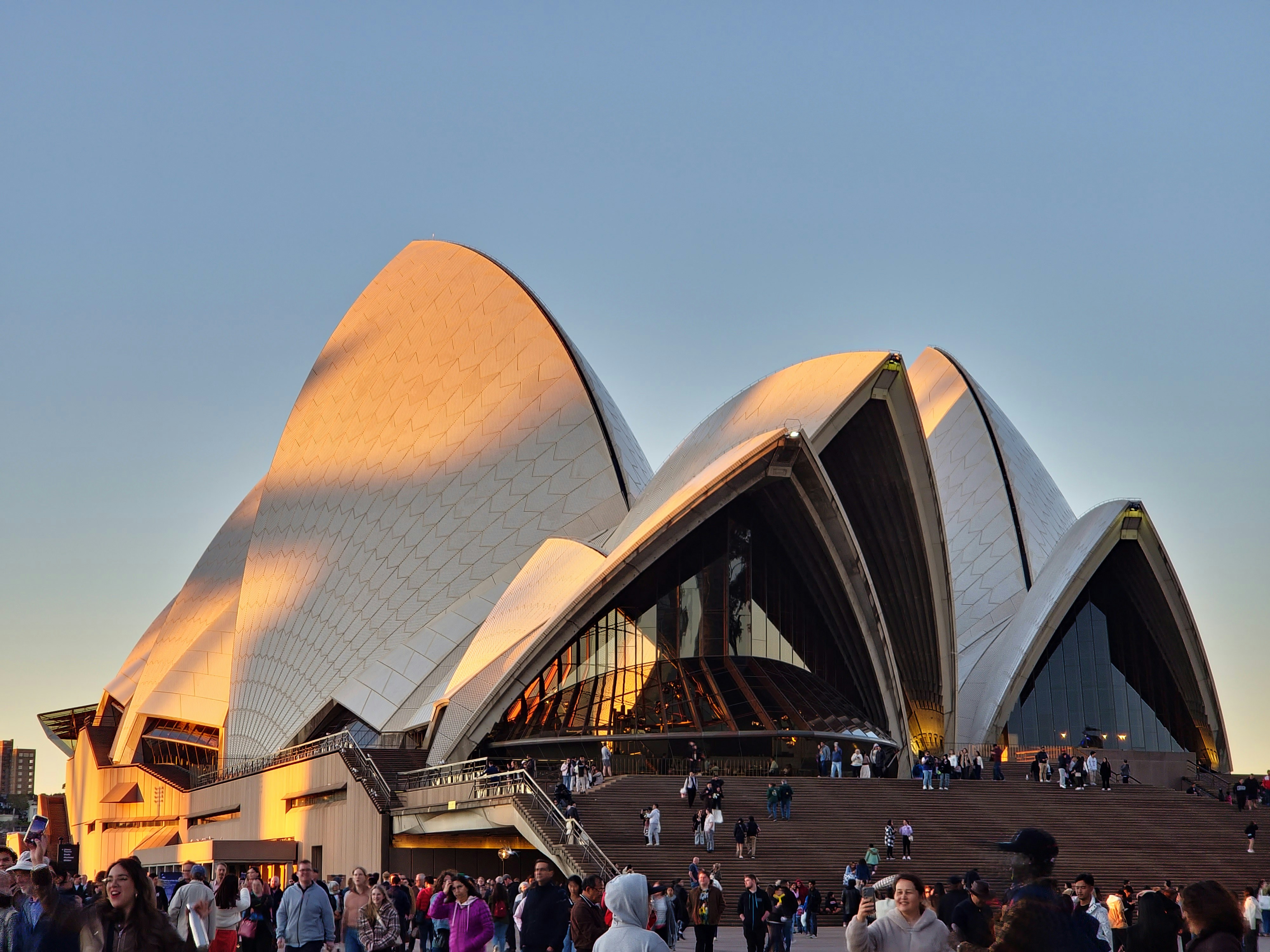 A large crowd of people walking around a building photo – Free Sydney ...