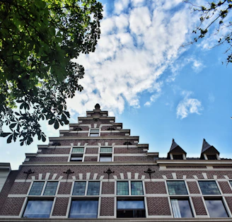 a tall brick building with lots of windows