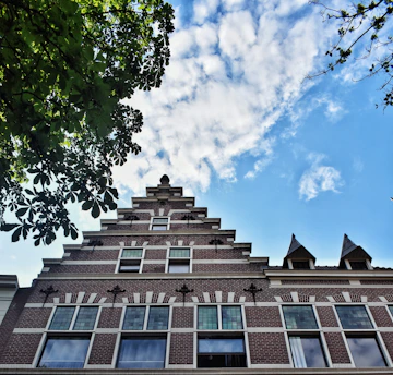 a tall brick building with lots of windows