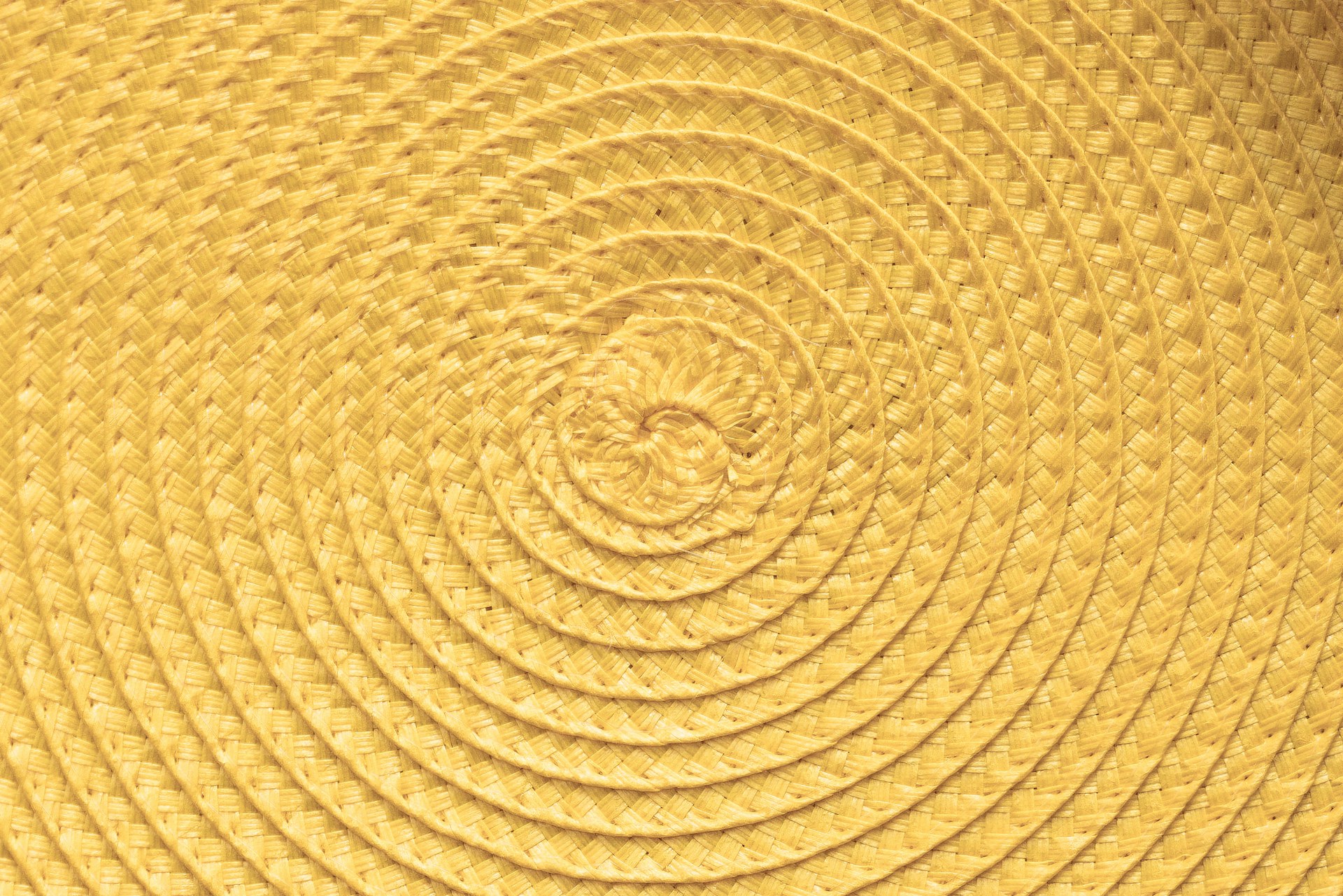 a yellow background with a spiral design