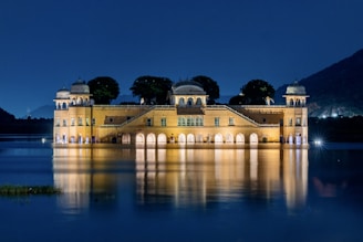 A large building sitting on top of a lake