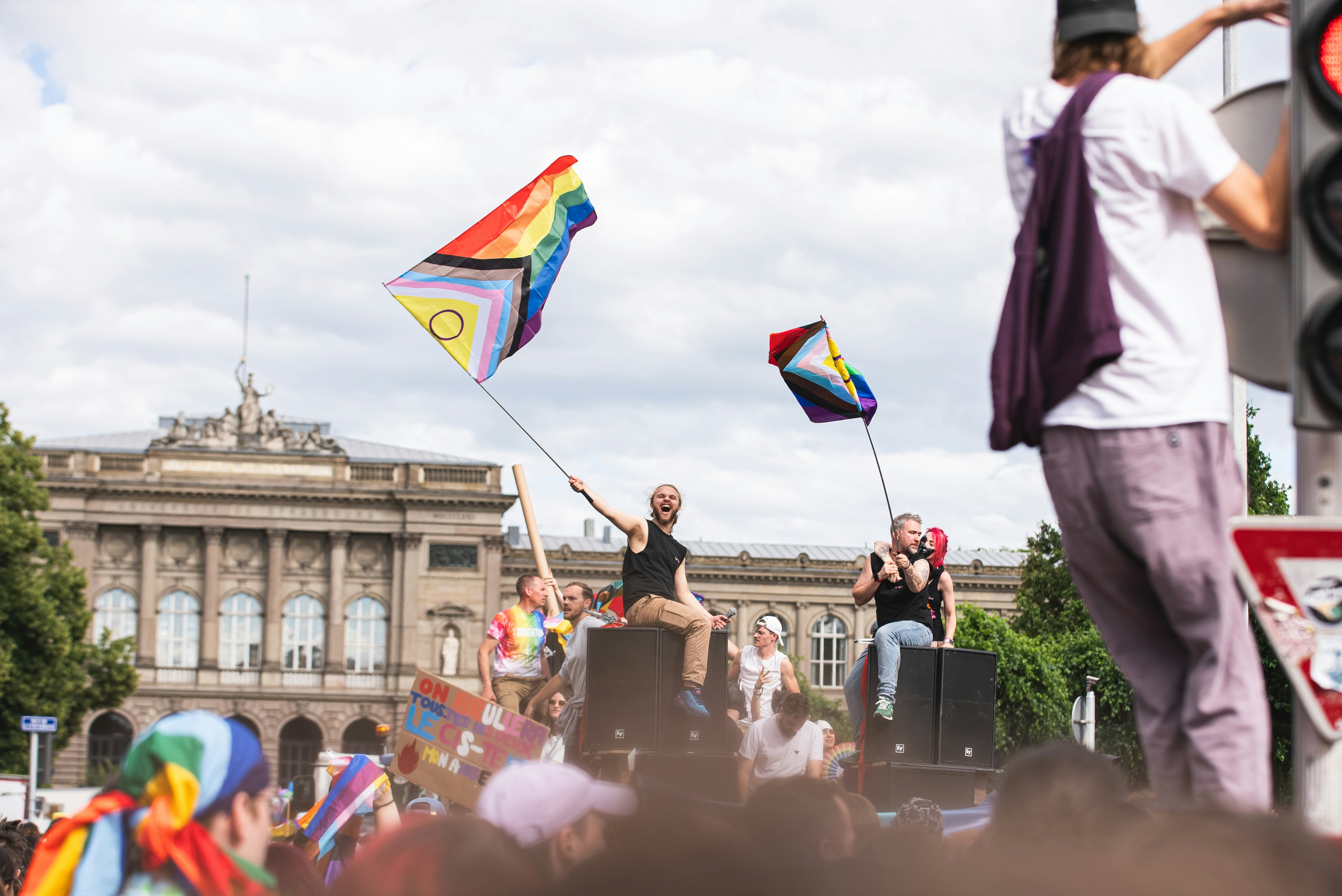 a group of people standing on a city street
