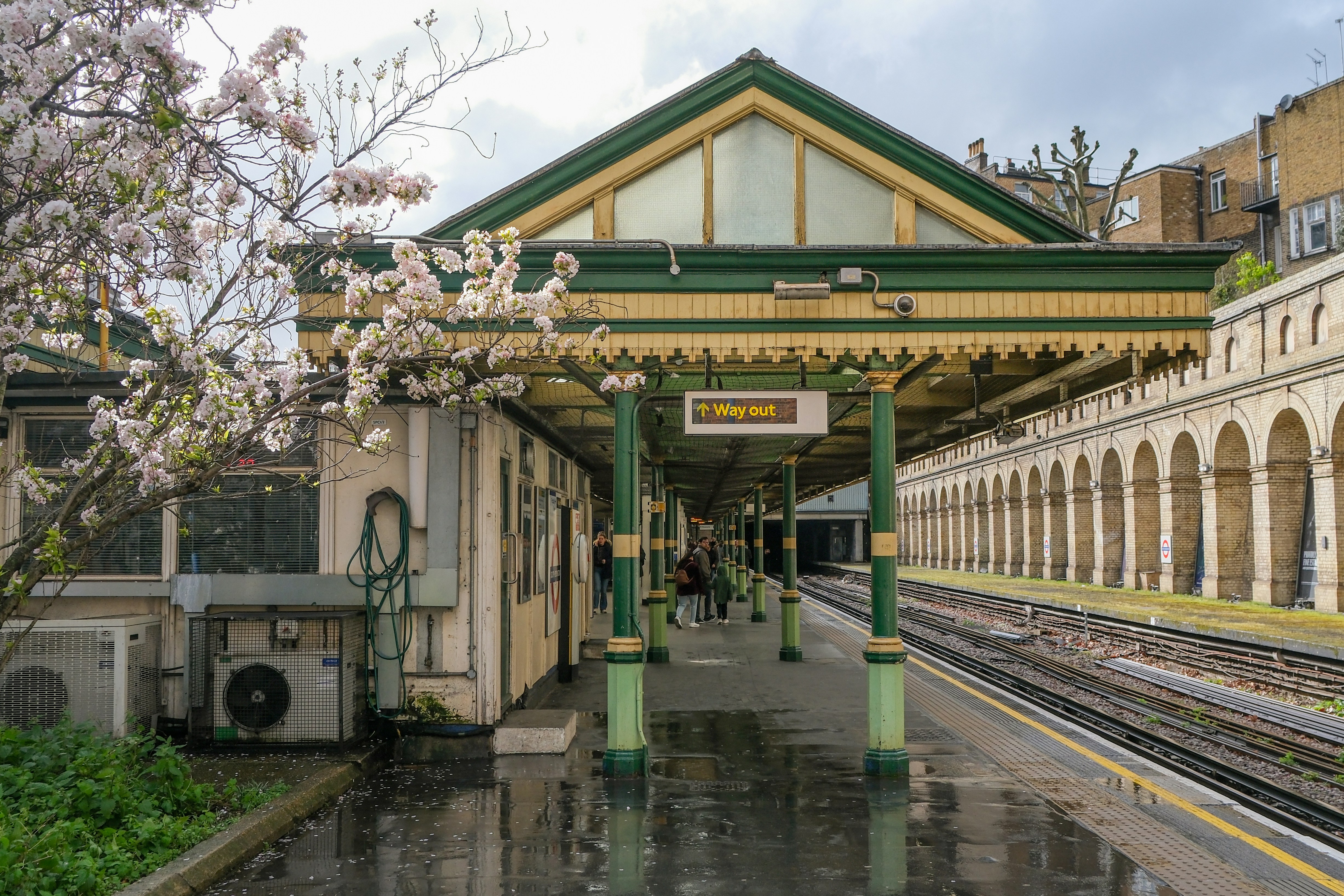 A train station with a train on the tracks
