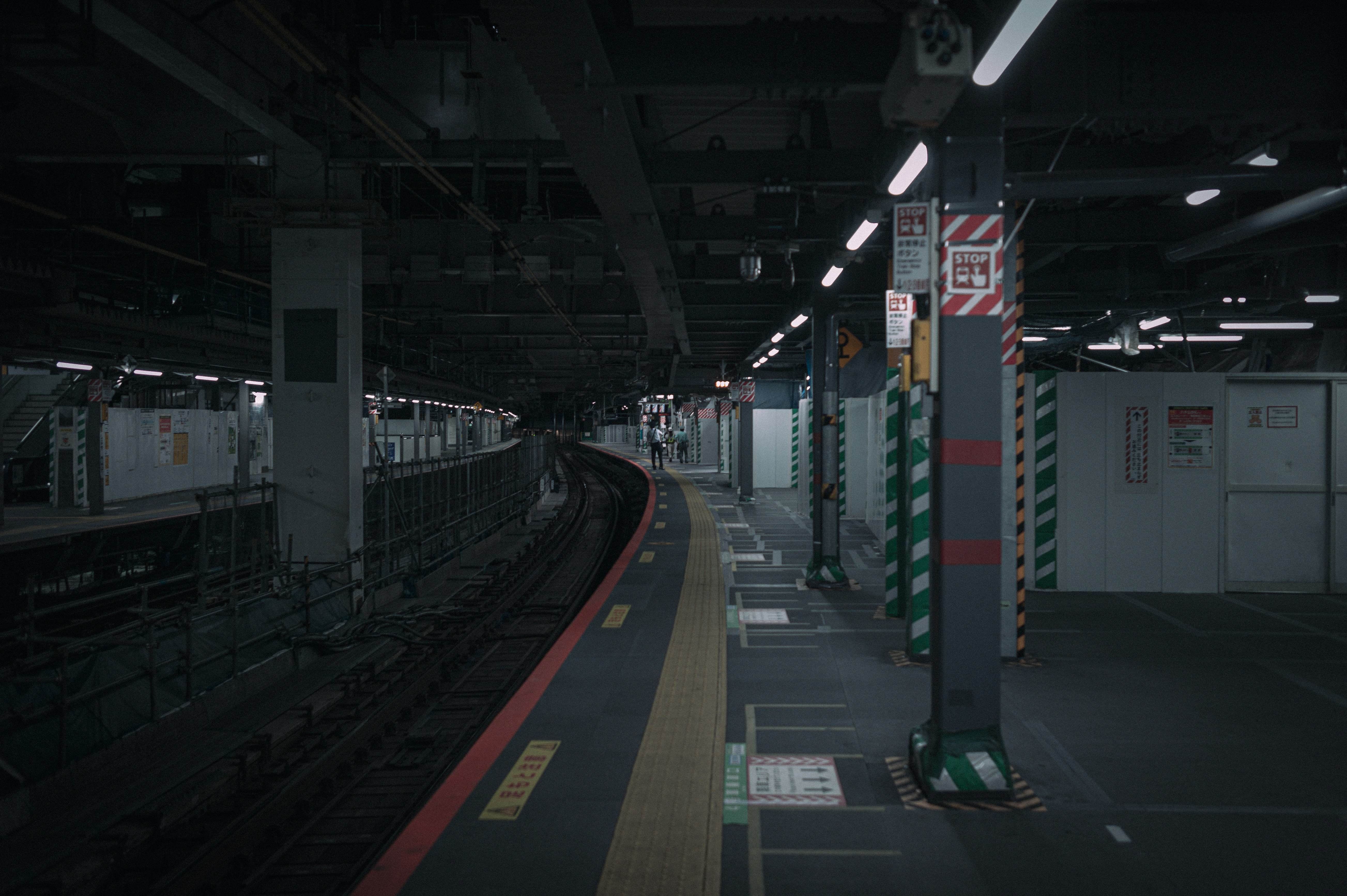 A train station with a train on the tracks