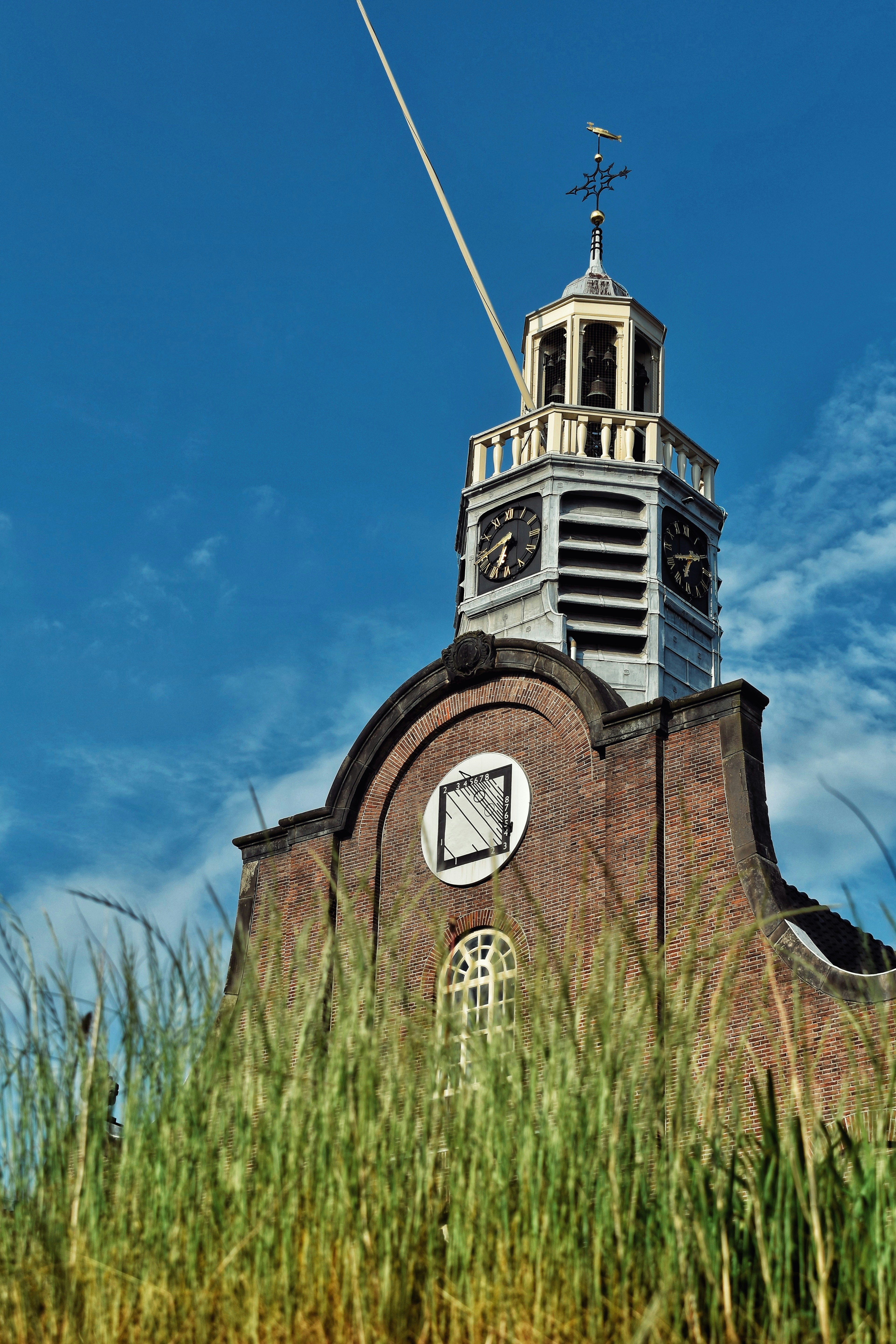 A tall tower with a clock on the top of it