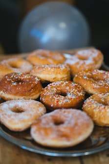 A bunch of doughnuts that are on a plate