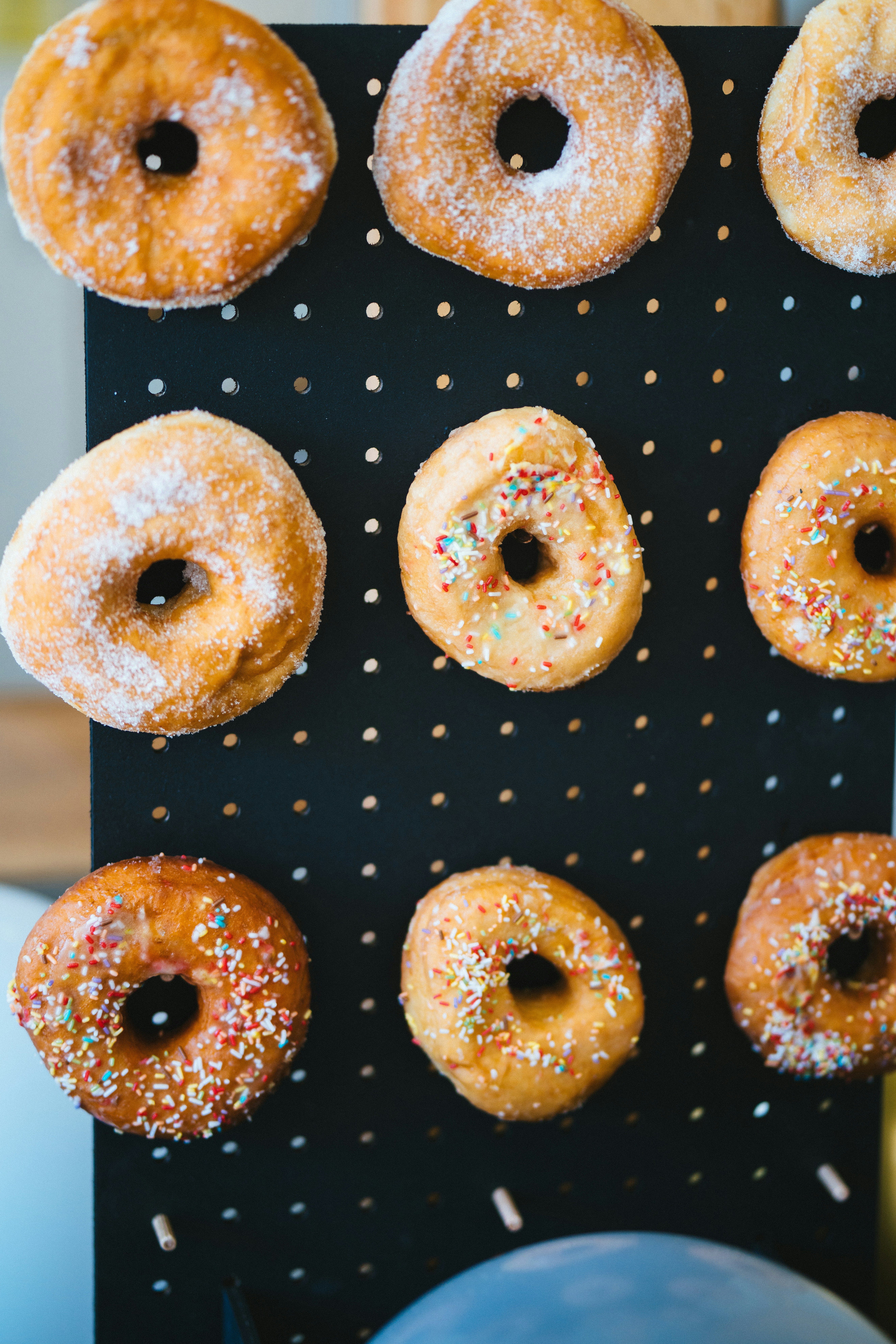 A bunch of doughnuts that are on a tray