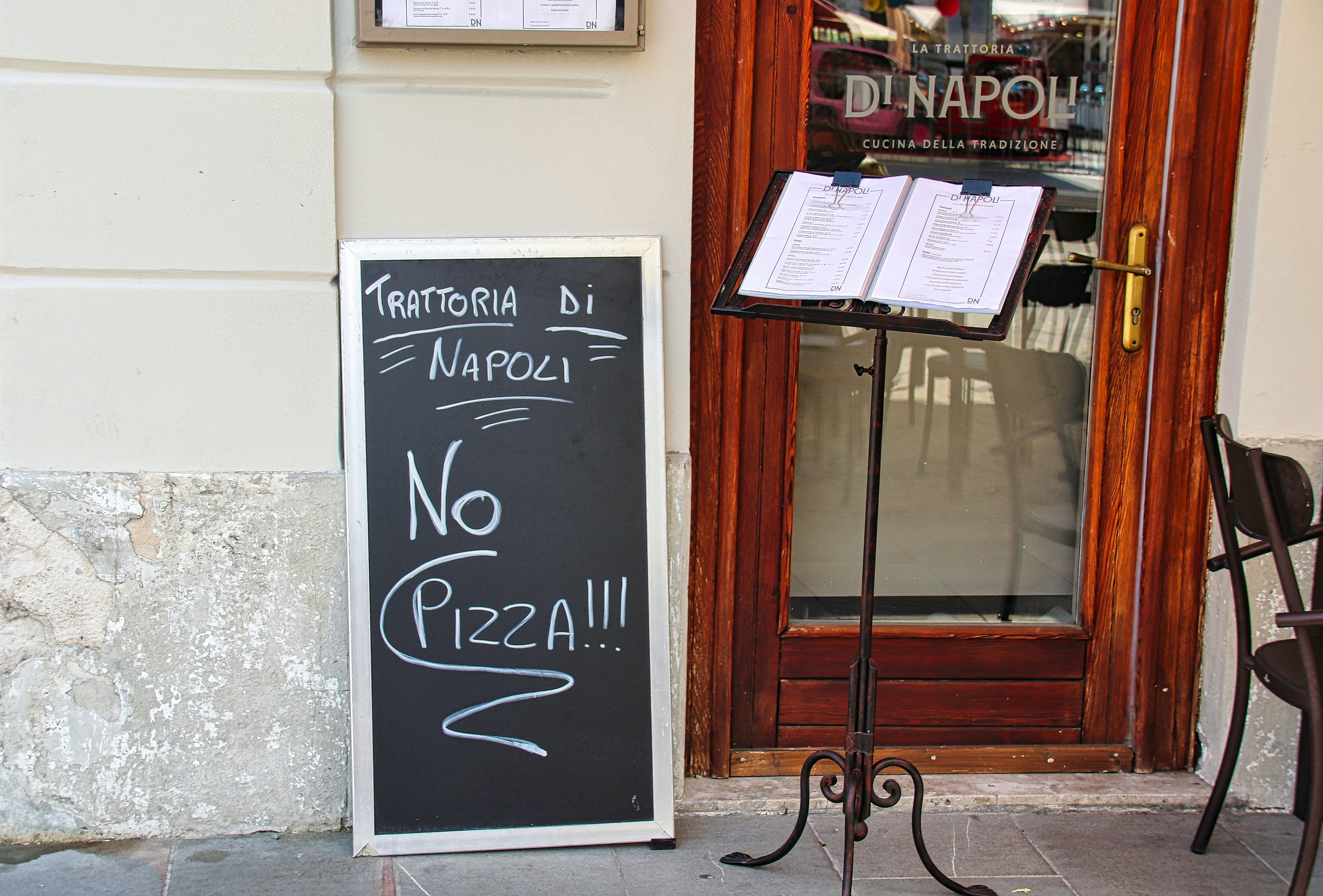 A sign that is outside of a restaurant