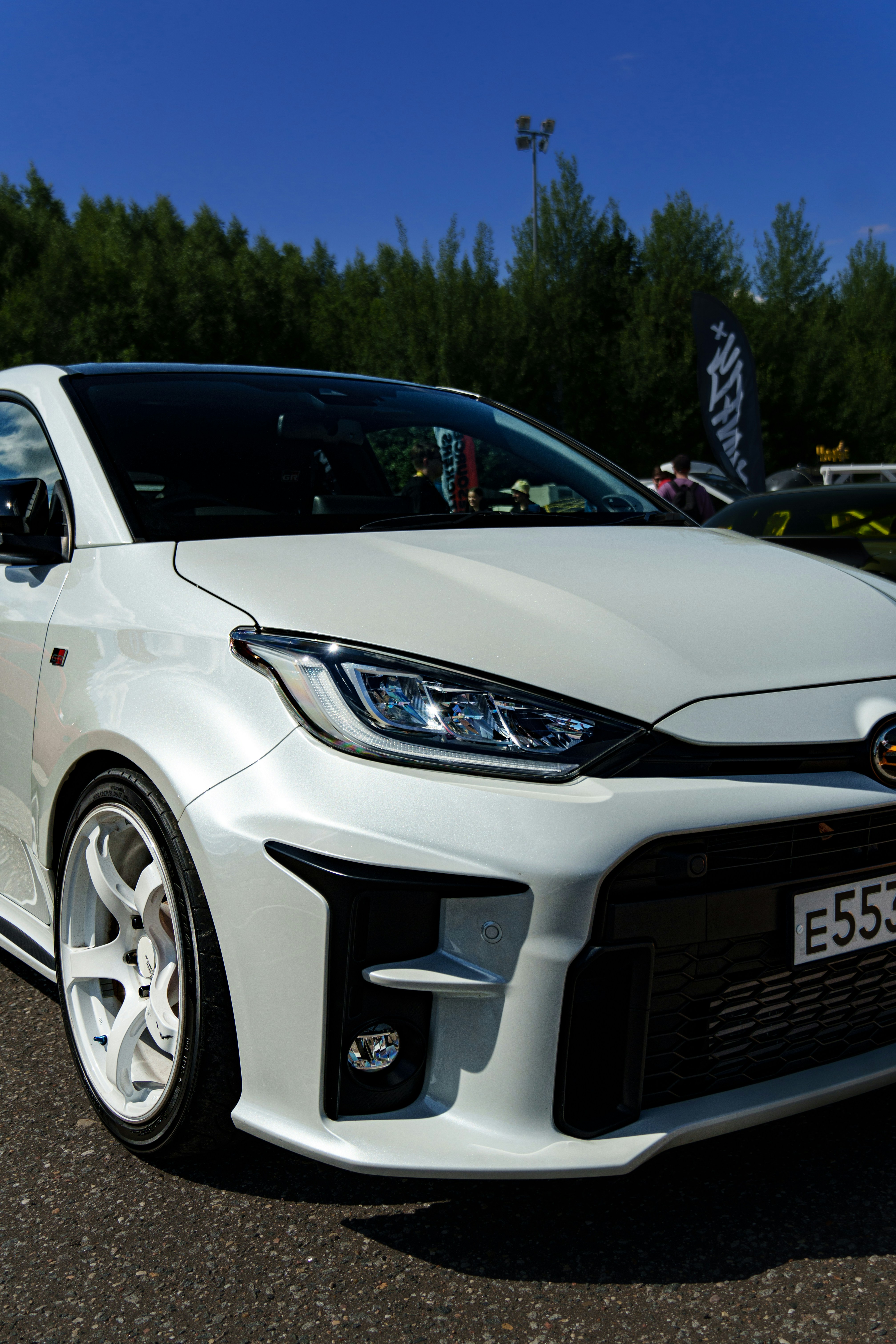 A white car parked in a parking lot