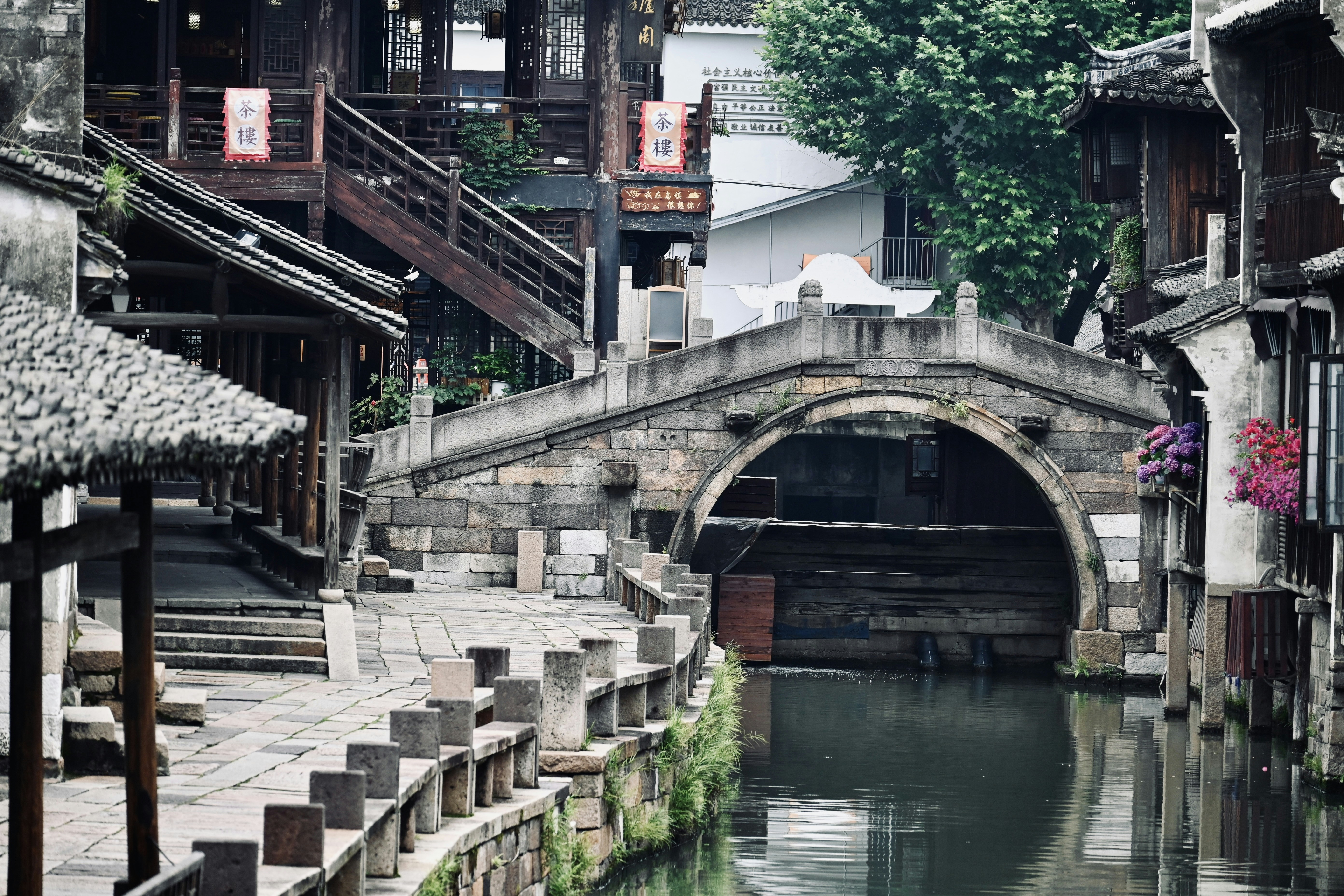 A bridge over a small river in a city