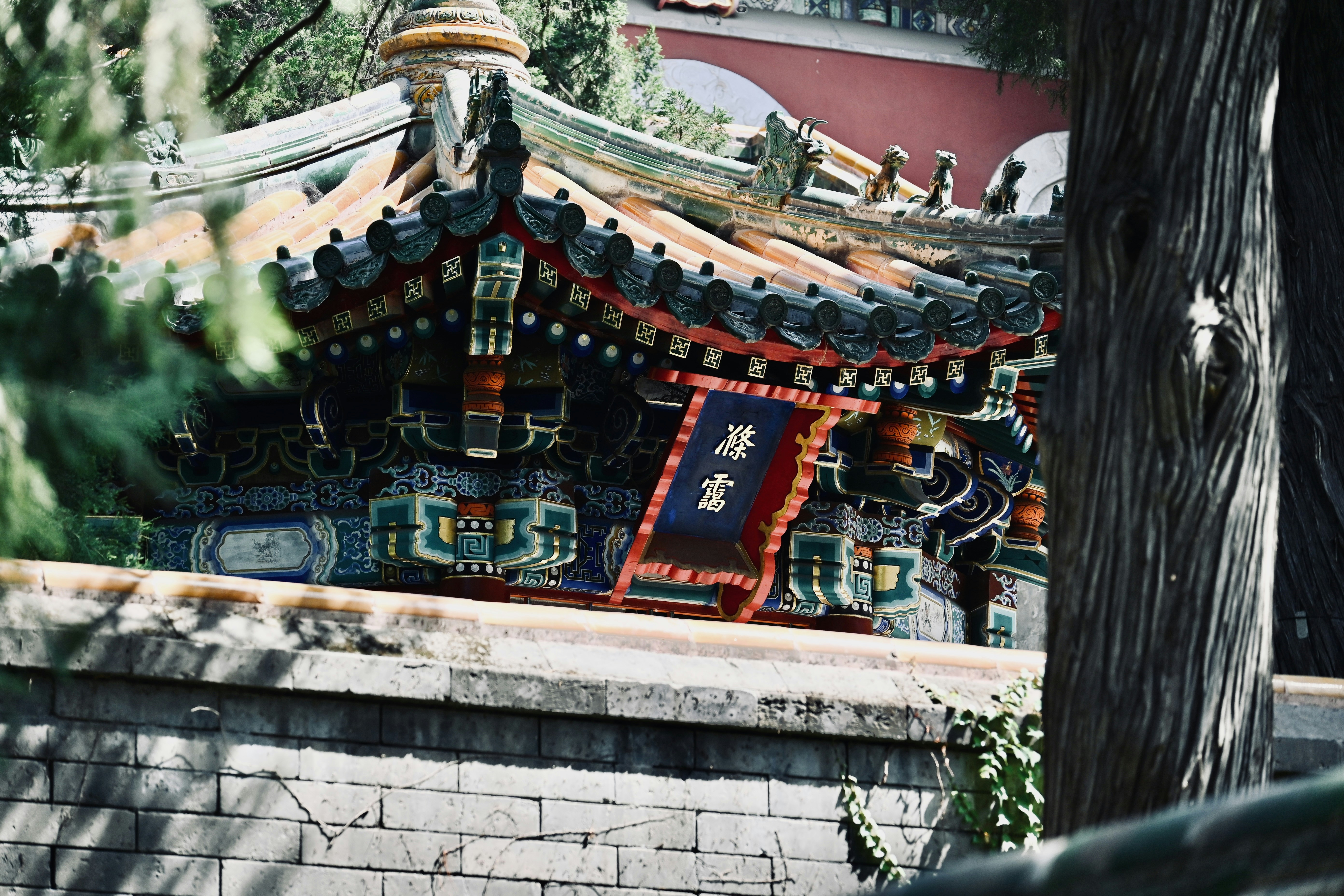 A chinese building with a clock on the top of it
