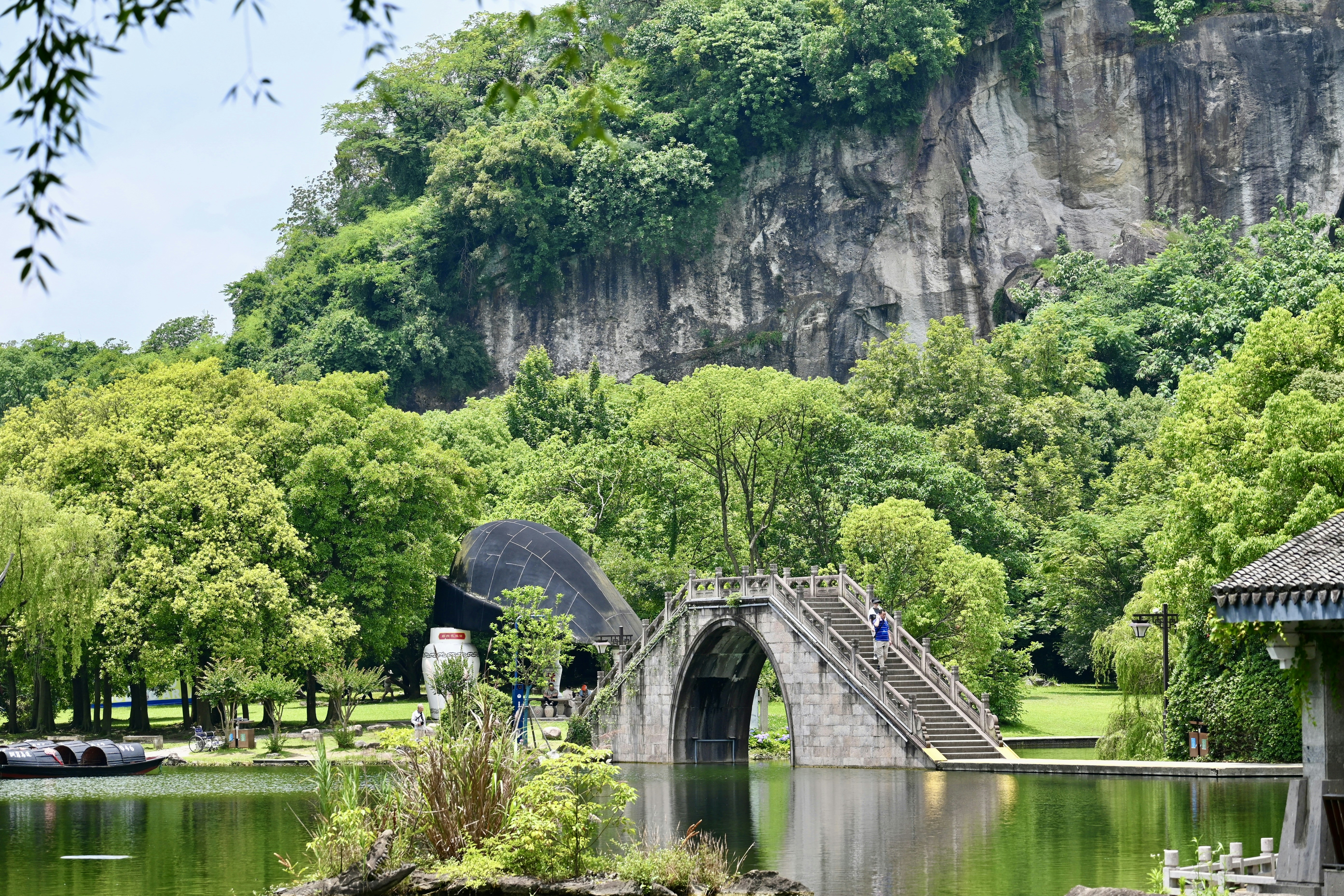 A lake with a bridge in the middle of it photo – Free Summer Image on ...