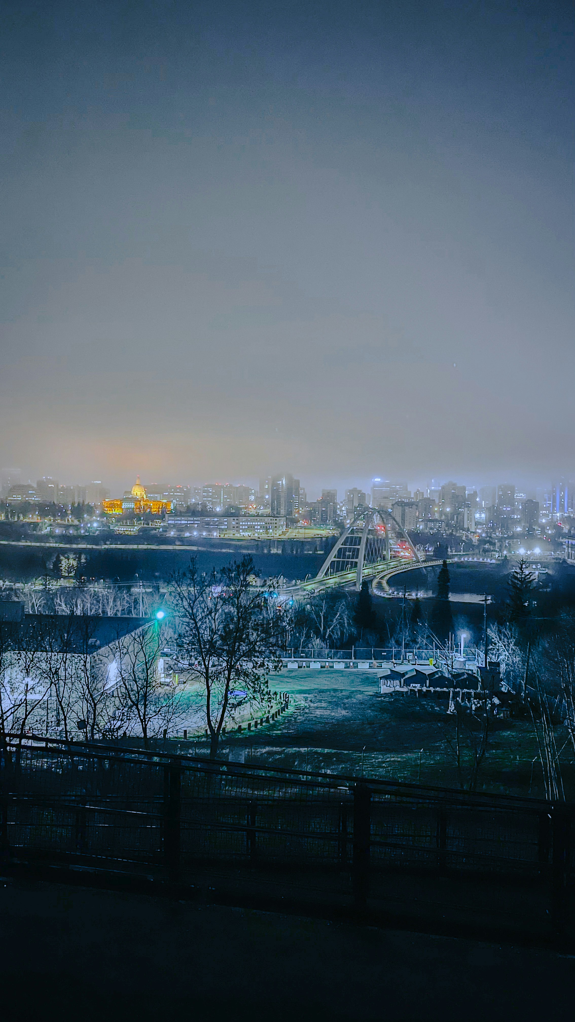 A view of a city at night from a distance photo – Free City Image on ...