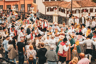 A large group of people standing around each other