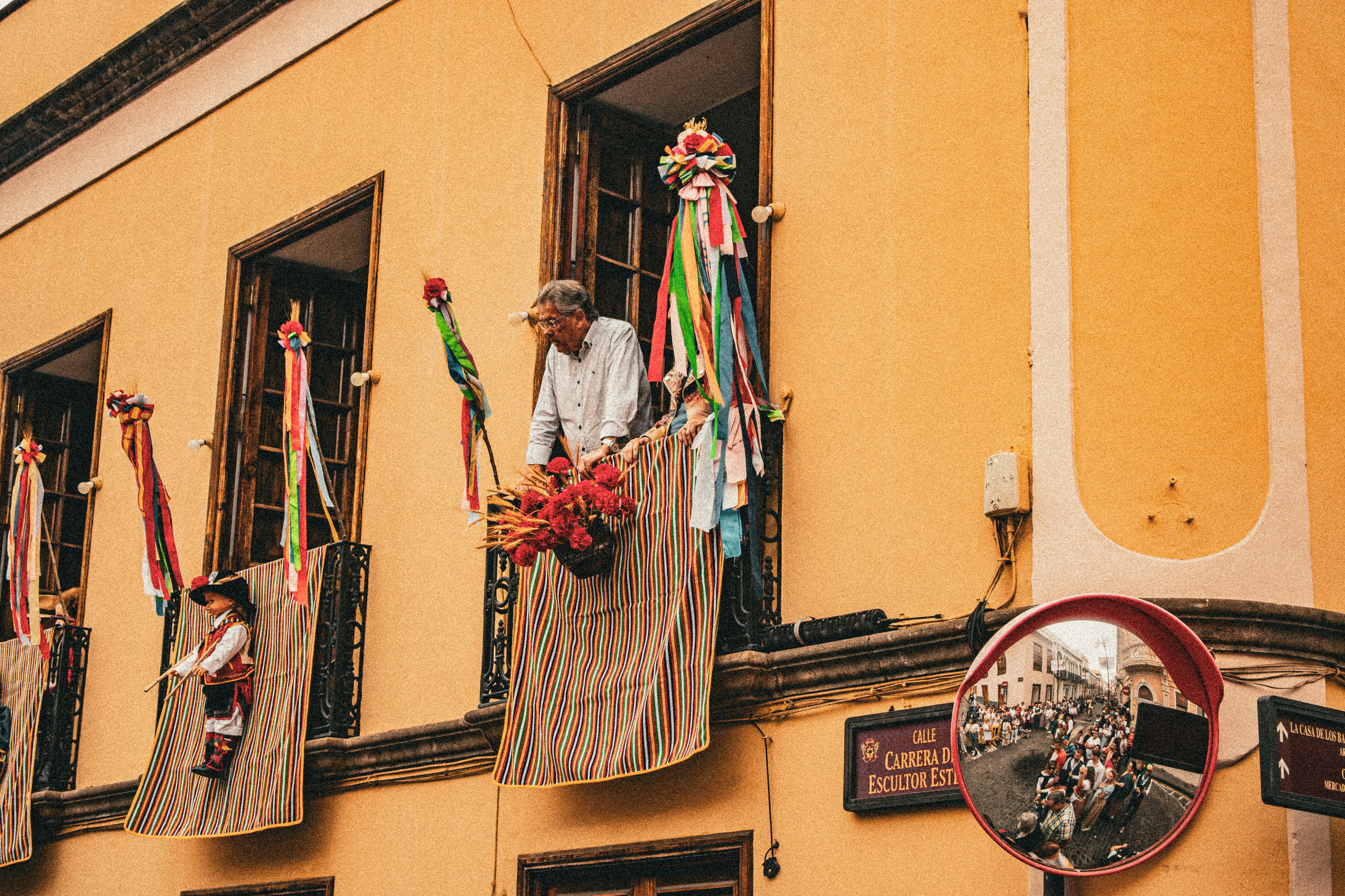 A man standing in a window of a building