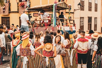 A group of people standing around in front of a crowd