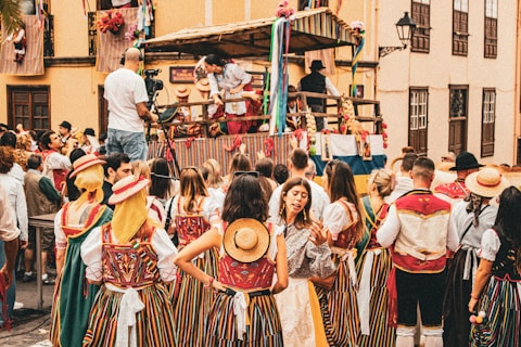 A group of people standing around in front of a crowd