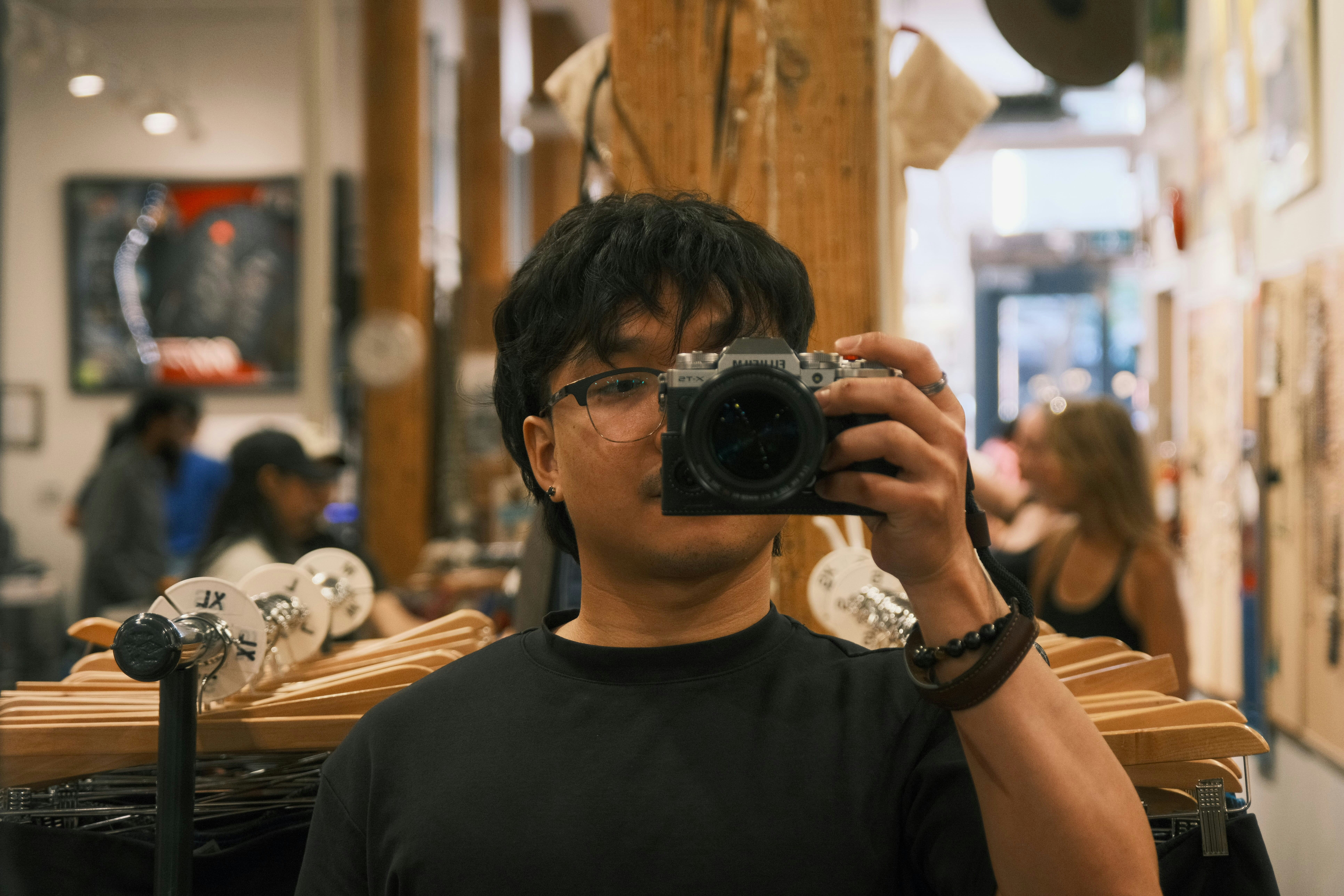 A man taking a picture of himself with a camera