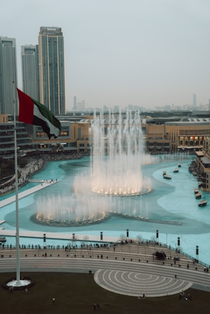 A large fountain with a flag on top of it