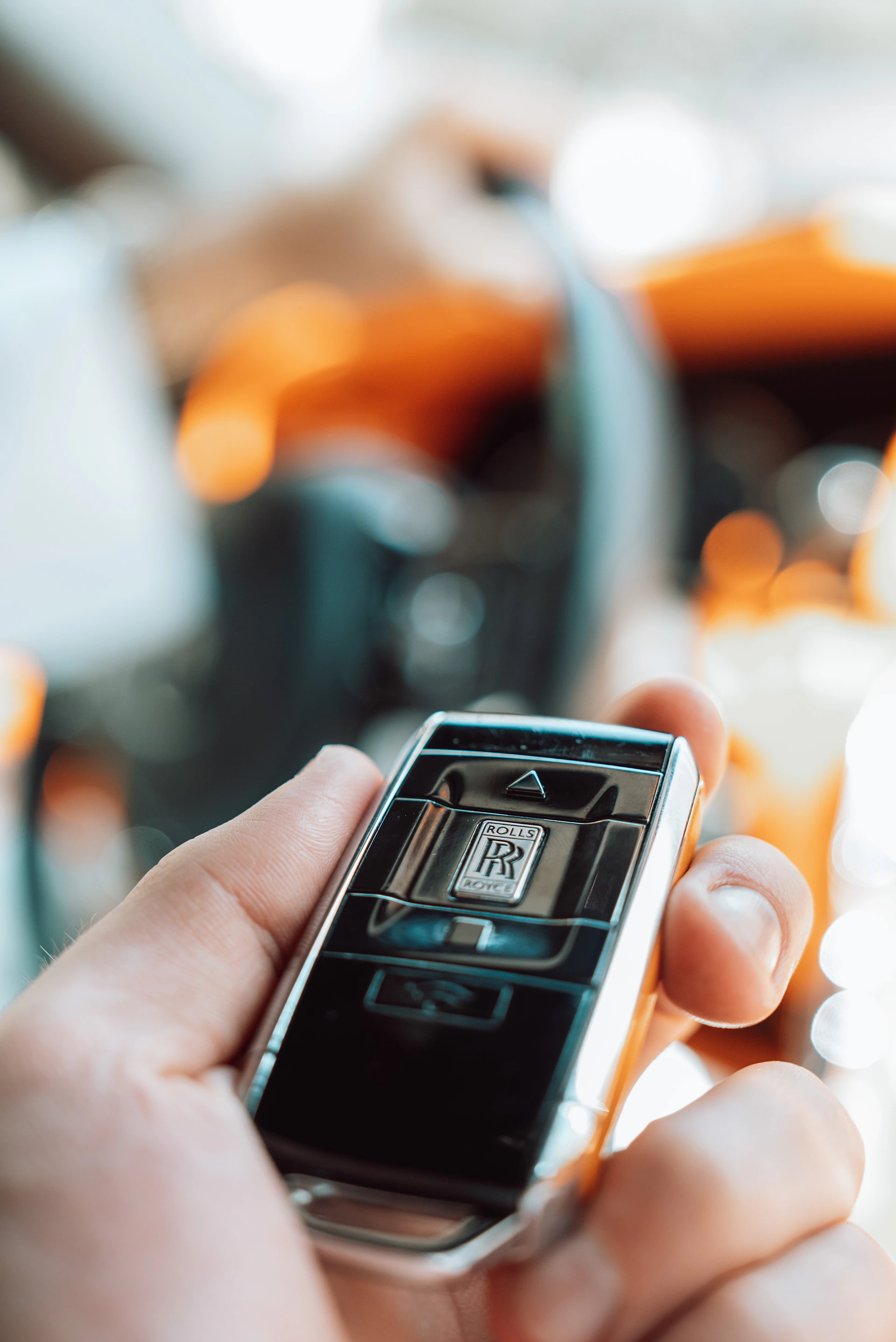 A person holding a cell phone in their hand