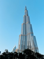 A very tall building towering over a city