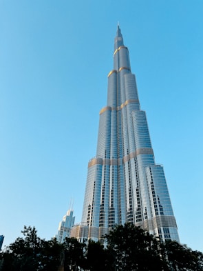 A very tall building towering over a city