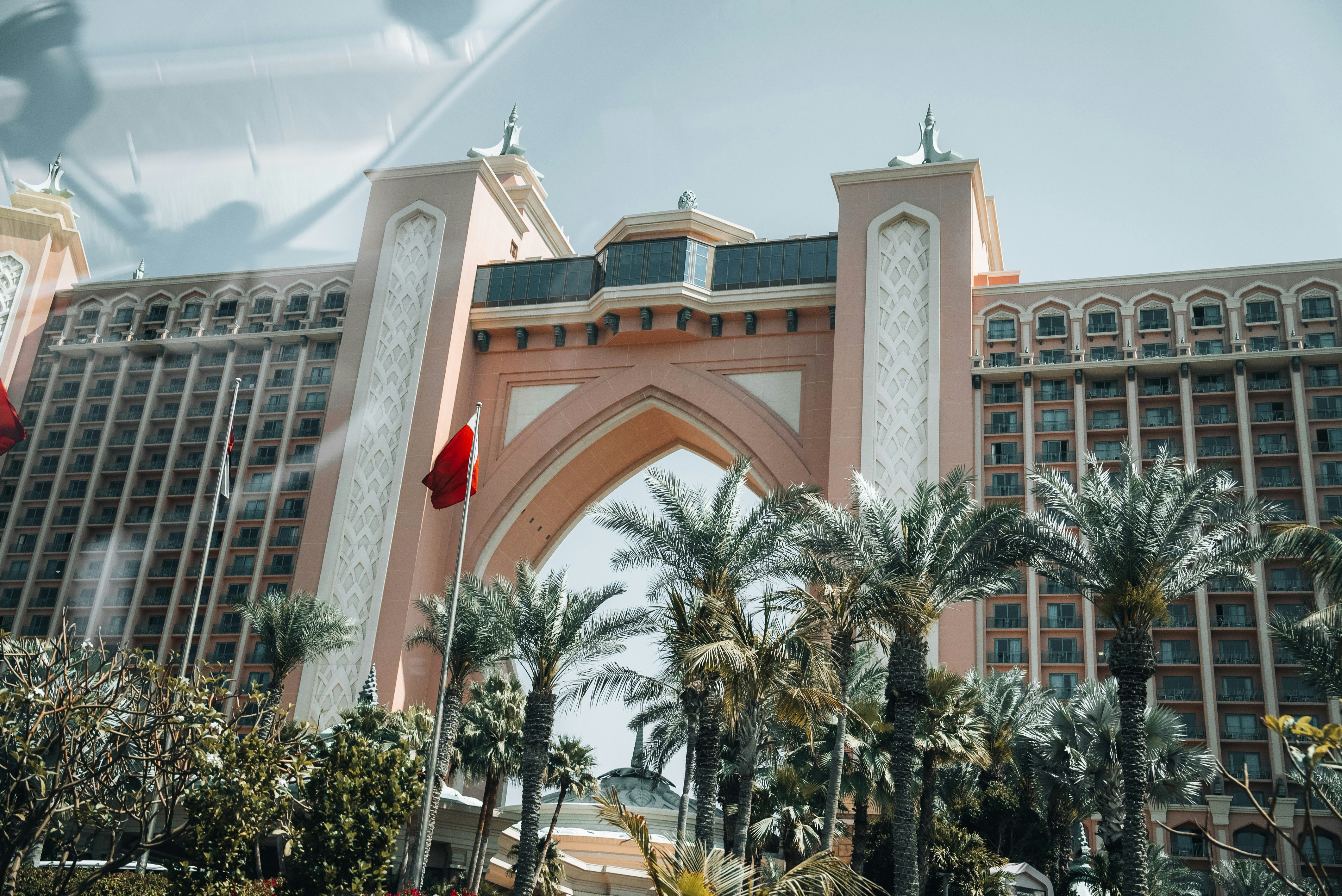 A large building with a clock tower in front of it