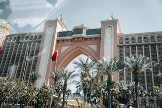 A large building with a clock tower in front of it