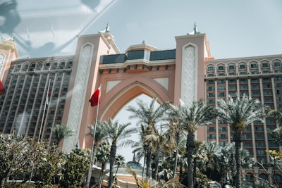 A large building with a clock tower in front of it
