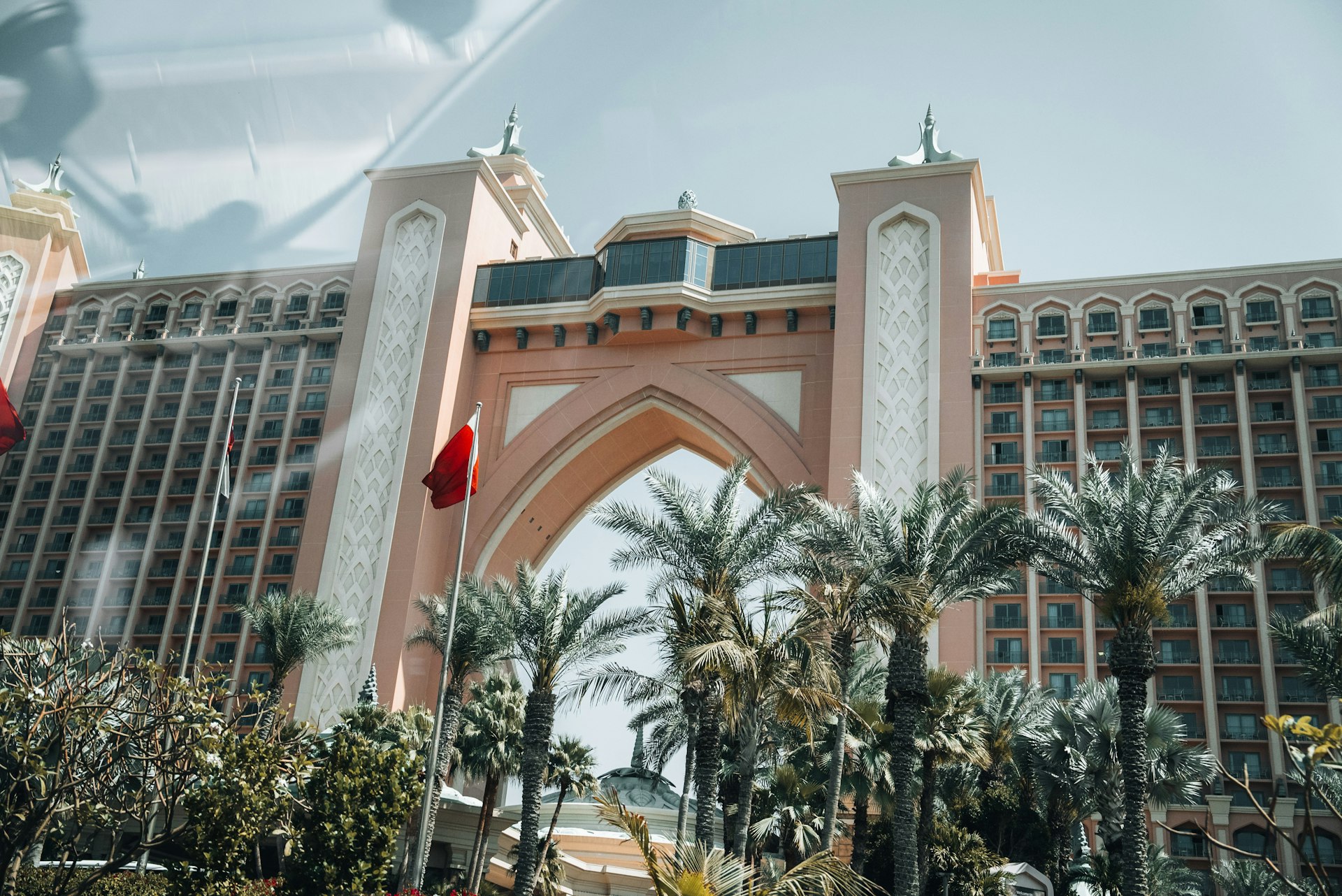 A large building with a clock tower in front of it