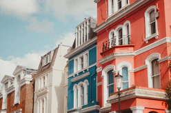 A row of multi - colored buildings on a city street