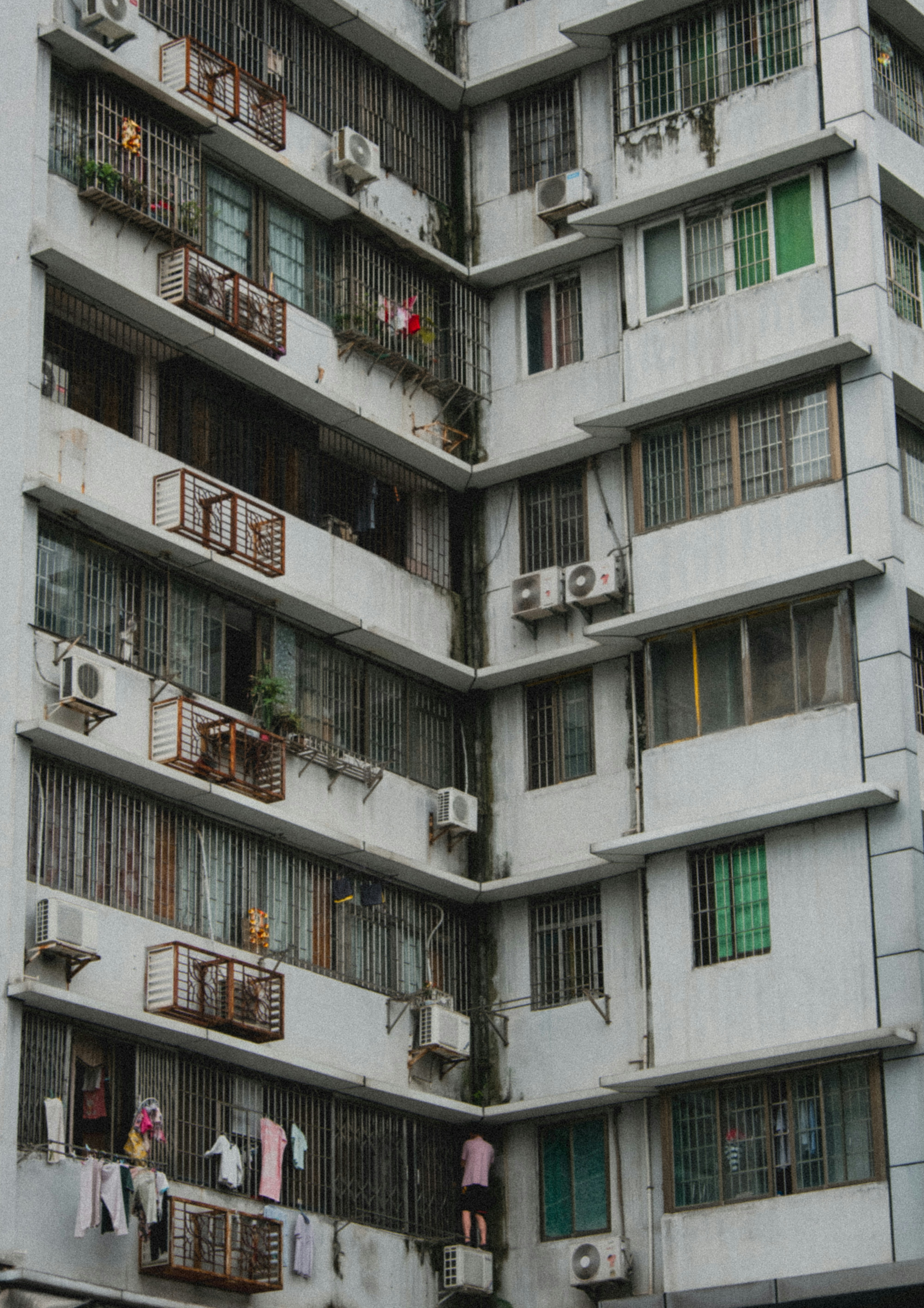 A tall white building with lots of windows