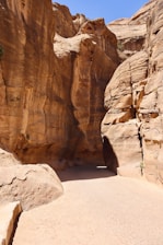 A narrow path in a canyon between two large rocks