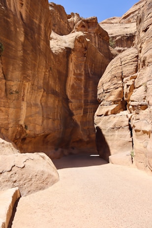 A narrow path in a canyon between two large rocks