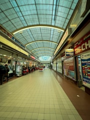 A mall filled with lots of shops and people