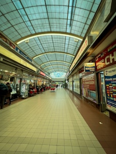 A mall filled with lots of shops and people