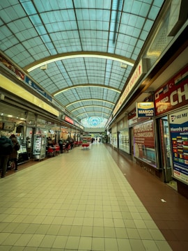 A mall filled with lots of shops and people