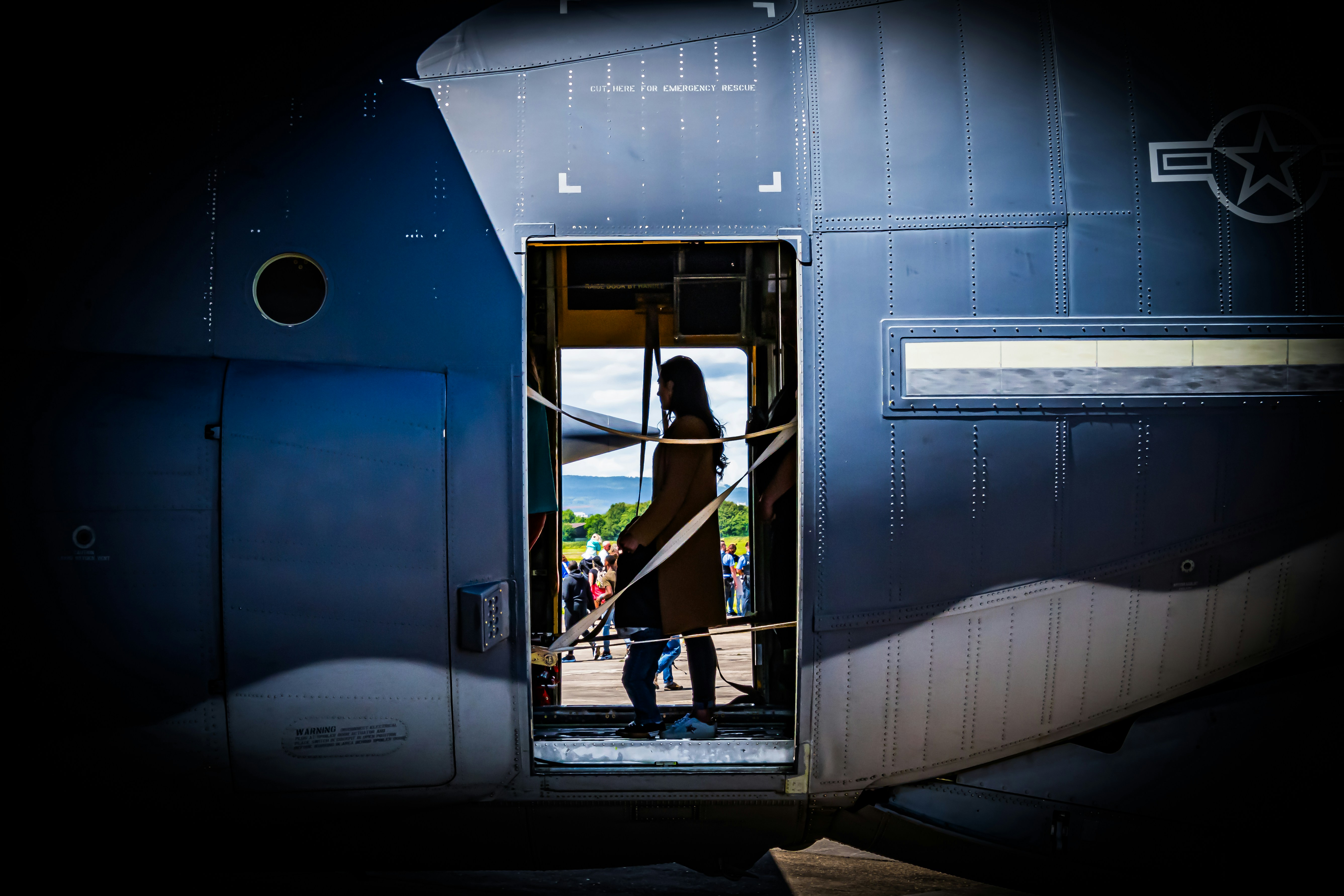 A woman standing in the doorway of a train