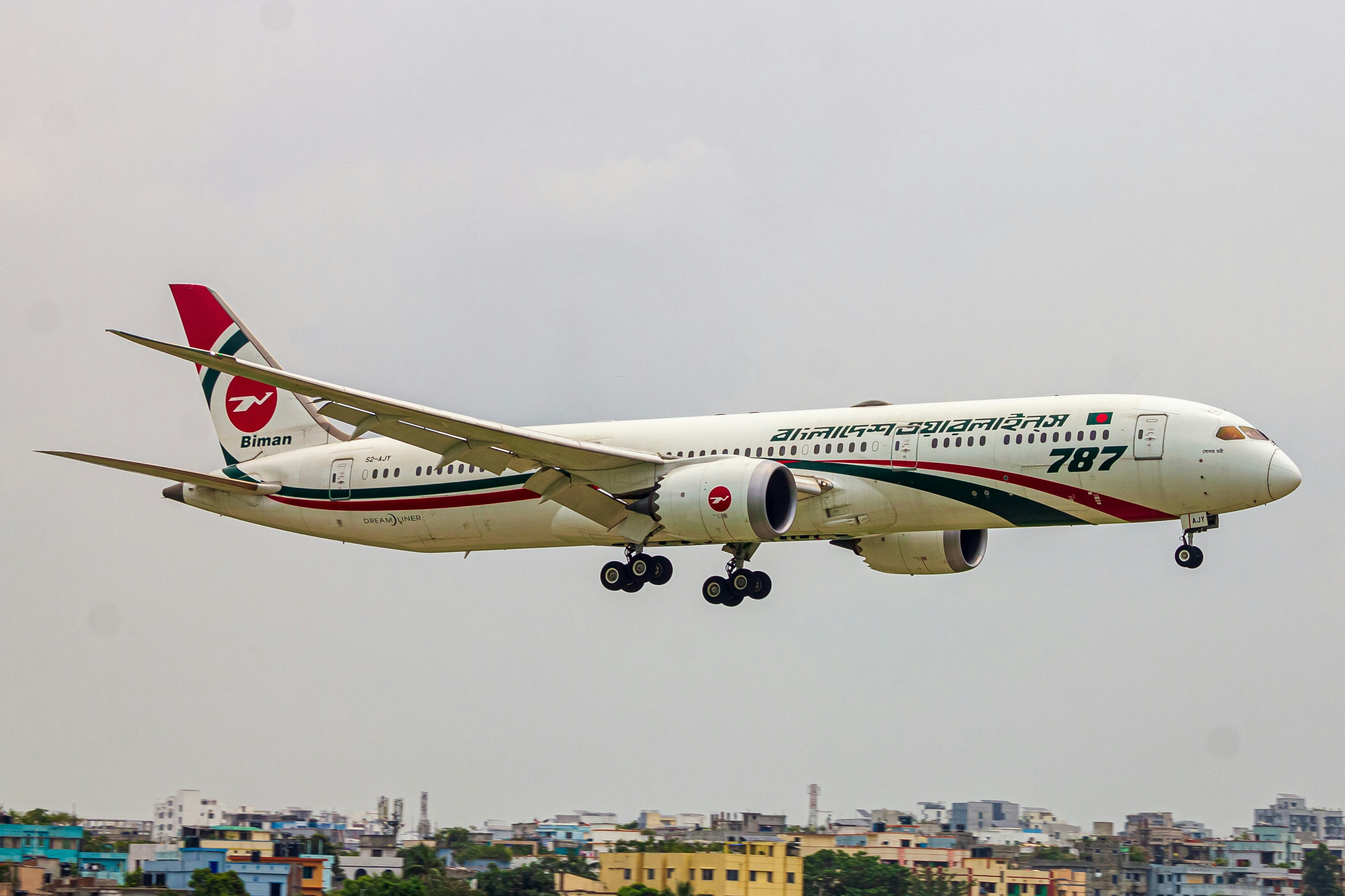 A large jetliner flying through a cloudy sky, B789 S2-AJY aka Sonar Tori ❤️
