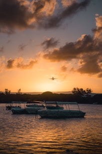 A group of boats floating on top of a body of water