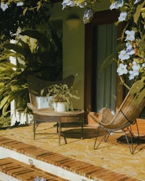 Two chairs and a table on a patio